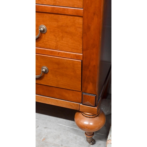 132 - A French cherrywood three-drawer commode chest on turned supports with brass casters, 120 x 54 x 92 ... 