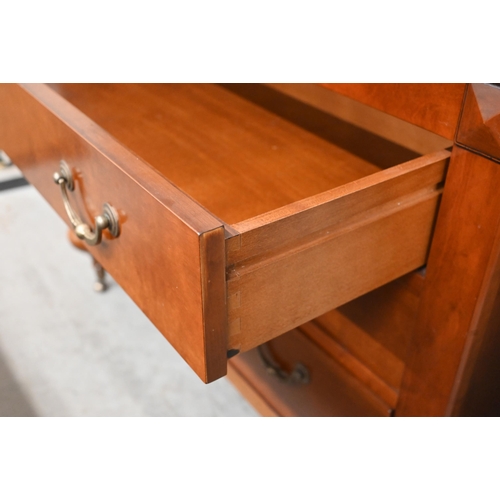 132 - A French cherrywood three-drawer commode chest on turned supports with brass casters, 120 x 54 x 92 ... 