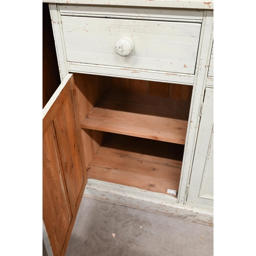 133 - Painted pine kitchen dresser, plate rack with three shelves on base with drawers and panelled cupboa... 