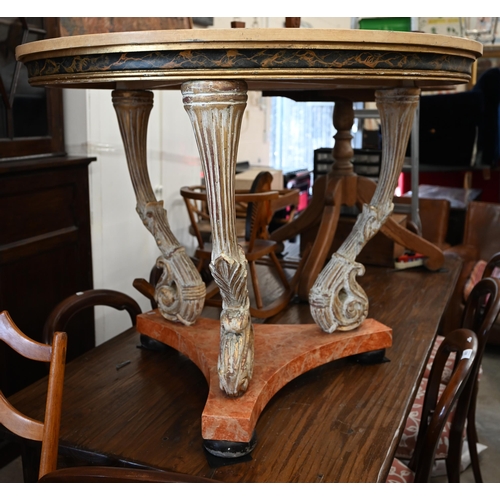 156 - A continental circular centre table with polychrome laminated top on three shaped aged gilt supports... 