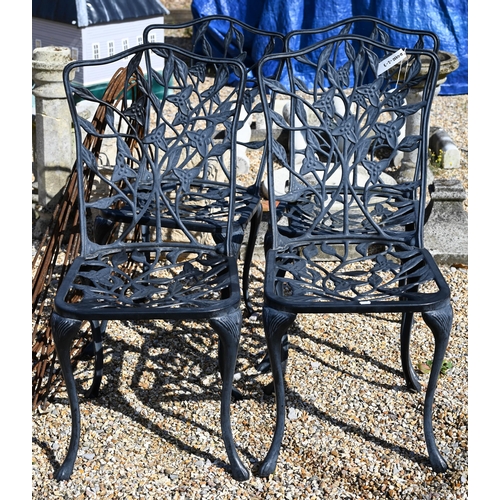 16 - A painted metal French bistro table with lattice top on folding base, 90 cm dia. to/w four black pow... 