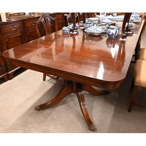 172 - A large reproduction mahogany twin pedestal extending dining table in Regency style with three optio... 