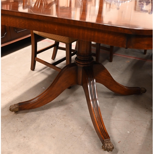 172 - A large reproduction mahogany twin pedestal extending dining table in Regency style with three optio... 