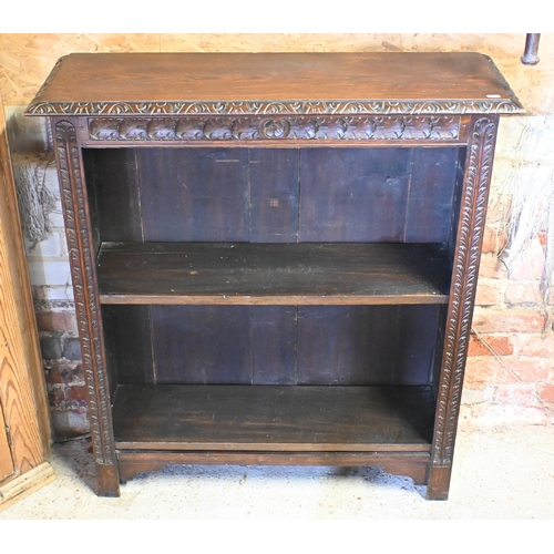 177 - A carved oak open bookcase with two shelves (some lacking dowel brackets) 92 cm w x 30 cm d x 102 cm... 