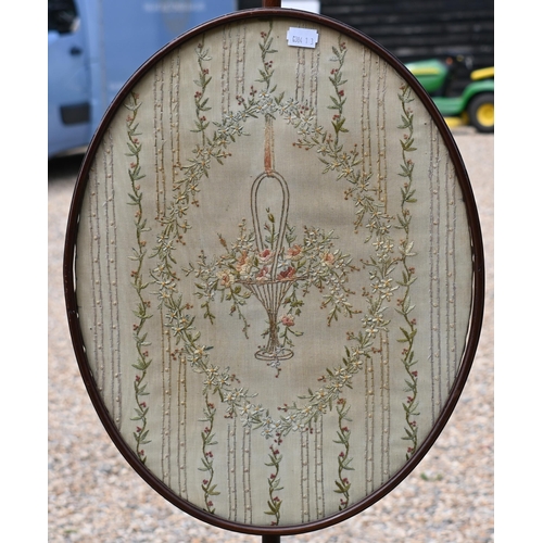 178 - A mahogany pole screen with glazed embroidered adjustable panel, 128 cm h