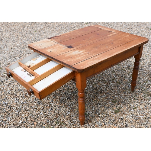 194 - A stained pine kitchen dining table with end drawer and turned supports, 90 cm x 110 cm x 74 cm h  (... 