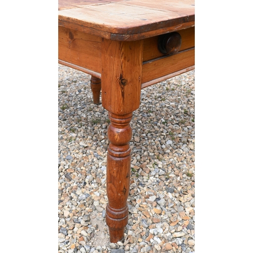 194 - A stained pine kitchen dining table with end drawer and turned supports, 90 cm x 110 cm x 74 cm h  (... 