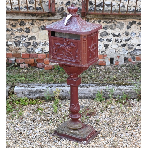 199 - A weathered metal domestic post-box, 110 cm h a/f