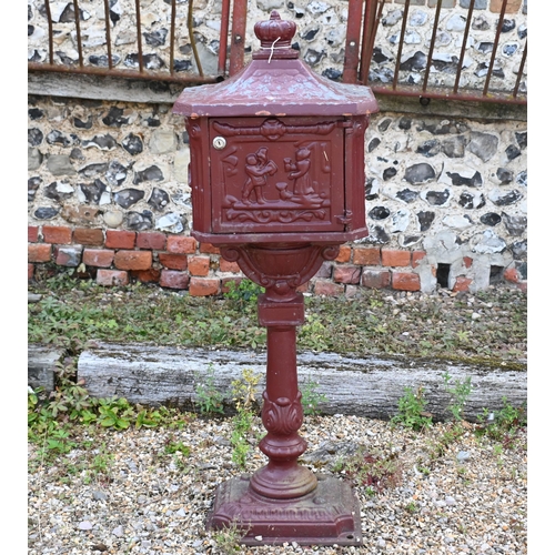 199 - A weathered metal domestic post-box, 110 cm h a/f