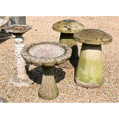 206 - Two composite stone staddle stones and caps, 66 cm h to/with a cast stone column birdbath and anothe... 