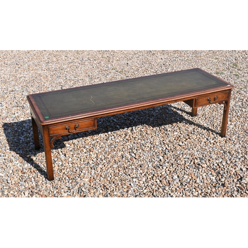 209 - # A mahogany green leather top coffee table with two drawers, 149 cm x 50 cm x 46 cm h