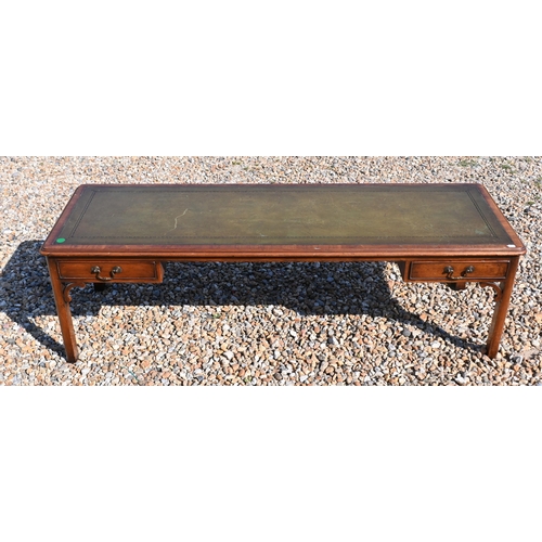 209 - # A mahogany green leather top coffee table with two drawers, 149 cm x 50 cm x 46 cm h