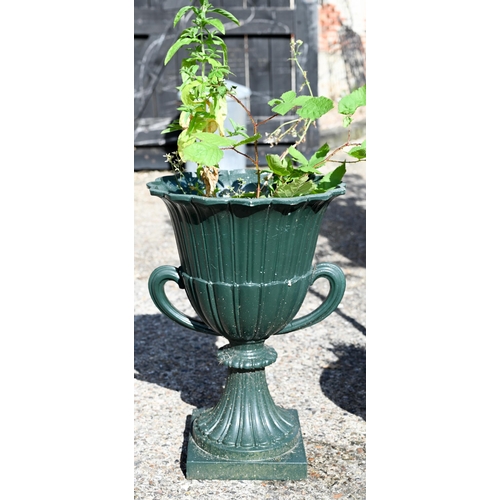 21 - A pair of cast iron twin-handled urn planters, in green paint finish, 63 cm high