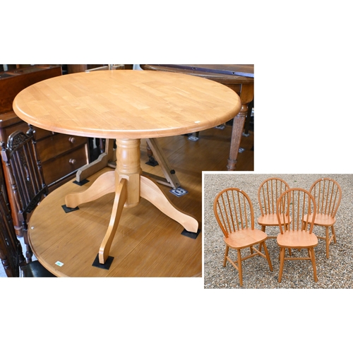 211 - A modern beechwood breakfast set comprising a circular table, 106 cm dia. x 74 cm h and set of four ... 