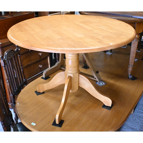 211 - A modern beechwood breakfast set comprising a circular table, 106 cm dia. x 74 cm h and set of four ... 