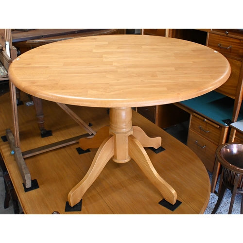 211 - A modern beechwood breakfast set comprising a circular table, 106 cm dia. x 74 cm h and set of four ... 