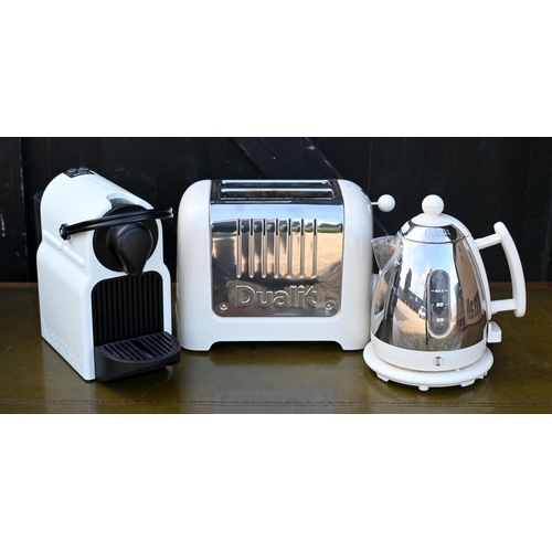 213 - A Dualit DMK1 kettle, white to/with a Dualit two slot toaster, white and a Nespresso machine, white,... 