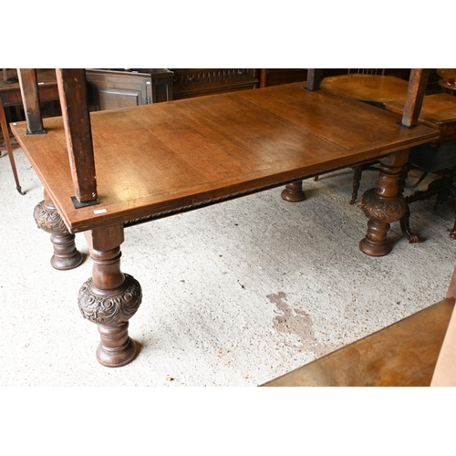 216 - A large Jacobean style oak draw leaf dining table, raised on moulded bulbous turned supports, 180 cm... 