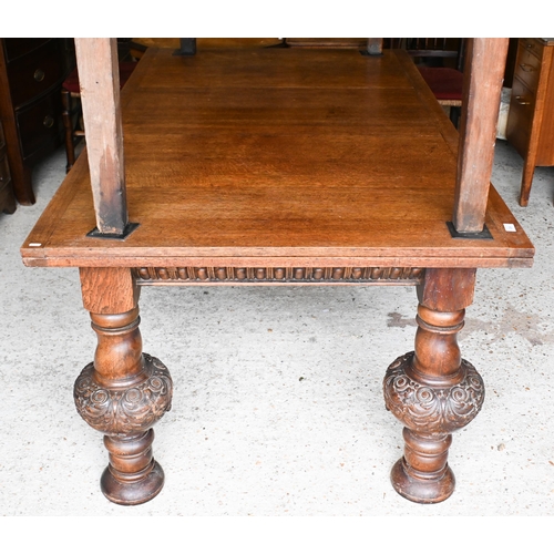 216 - A large Jacobean style oak draw leaf dining table, raised on moulded bulbous turned supports, 180 cm... 