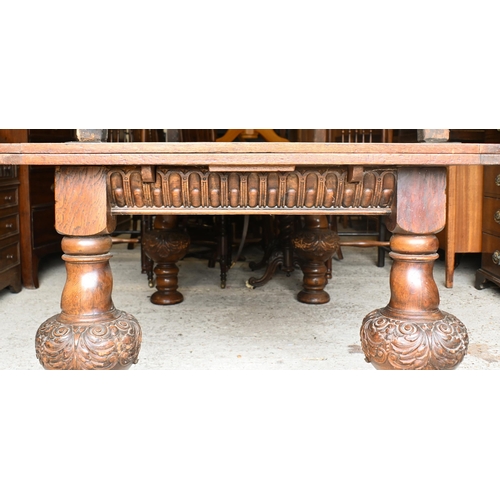 216 - A large Jacobean style oak draw leaf dining table, raised on moulded bulbous turned supports, 180 cm... 