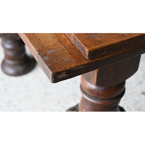 216 - A large Jacobean style oak draw leaf dining table, raised on moulded bulbous turned supports, 180 cm... 