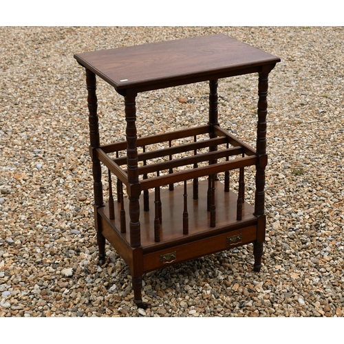 222 - An Edwardian mahogany Canterbury style music stand, with three division base over a drawer, raised o... 