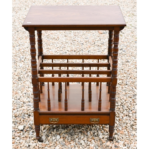 222 - An Edwardian mahogany Canterbury style music stand, with three division base over a drawer, raised o... 