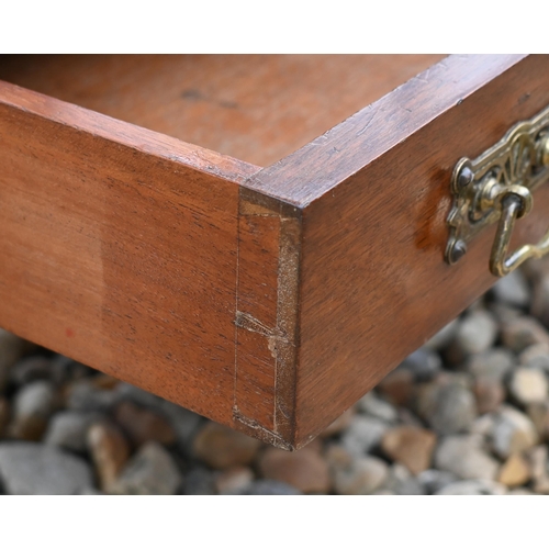 222 - An Edwardian mahogany Canterbury style music stand, with three division base over a drawer, raised o... 