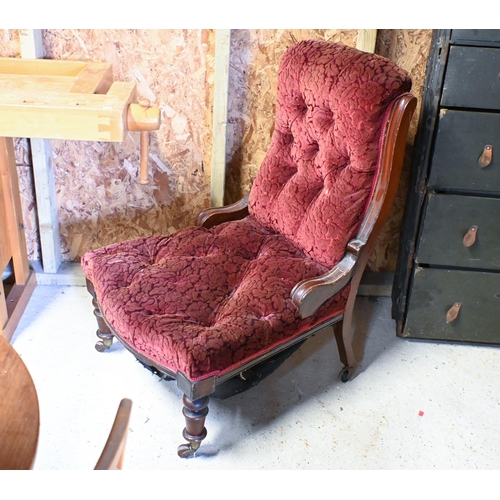 226 - A Victorian walnut framed button back floral fabric covered chair, on ceramic casters