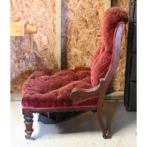 226 - A Victorian walnut framed button back floral fabric covered chair, on ceramic casters