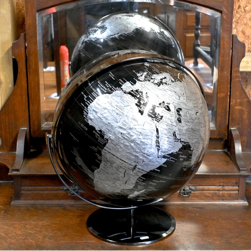 230 - A contemporary table top world globe on stand, by Tristan de Cumha Group, 40 cm dia.