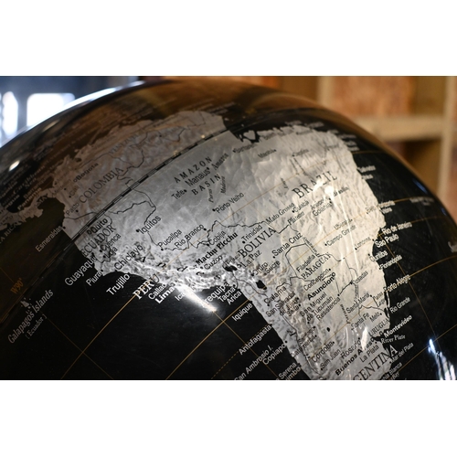 230 - A contemporary table top world globe on stand, by Tristan de Cumha Group, 40 cm dia.