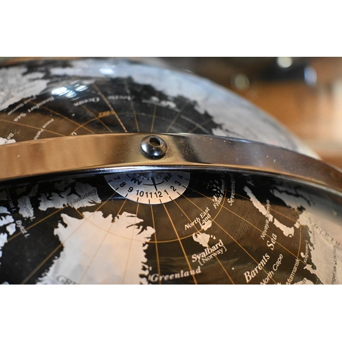 230 - A contemporary table top world globe on stand, by Tristan de Cumha Group, 40 cm dia.