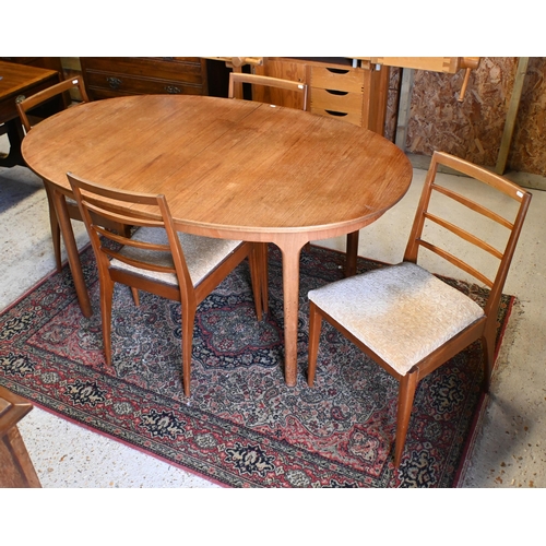 231 - A mid-century teak extending Mackintosh dining table, with integral butterfly leaf, to/with four cha... 