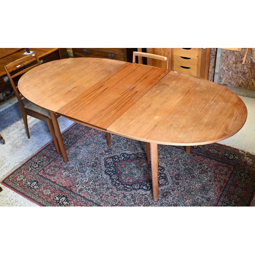 231 - A mid-century teak extending Mackintosh dining table, with integral butterfly leaf, to/with four cha... 