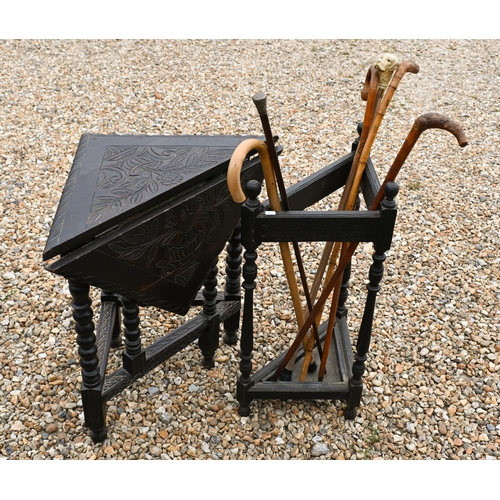 233 - A 17th century credence style stained oak corner table, to/with an oak corner stick stand and sticks... 