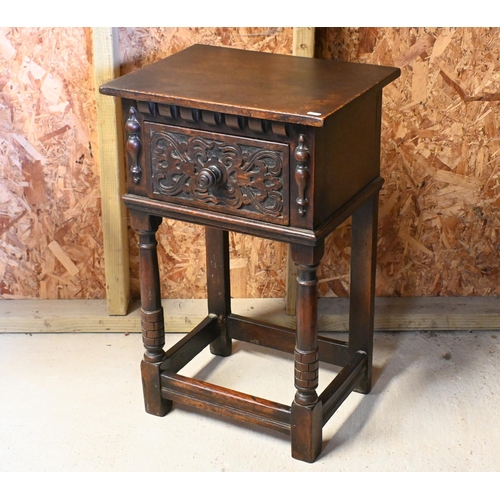 234 - A 17th century style carved oak single drawer bedside table