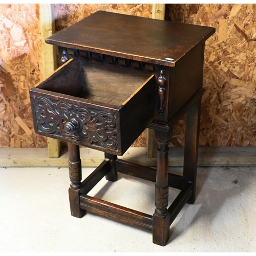 234 - A 17th century style carved oak single drawer bedside table