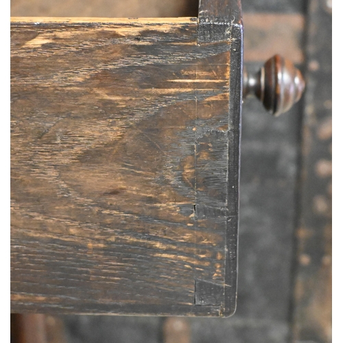 234 - A 17th century style carved oak single drawer bedside table