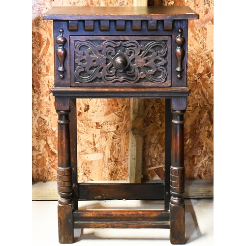 234 - A 17th century style carved oak single drawer bedside table