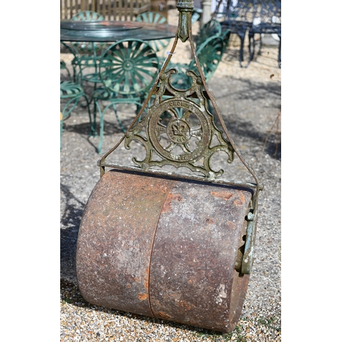 25 - # An antique cast iron garden roller