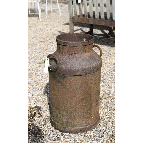 27 - A cast iron milk churn, a/f, 65 cm high