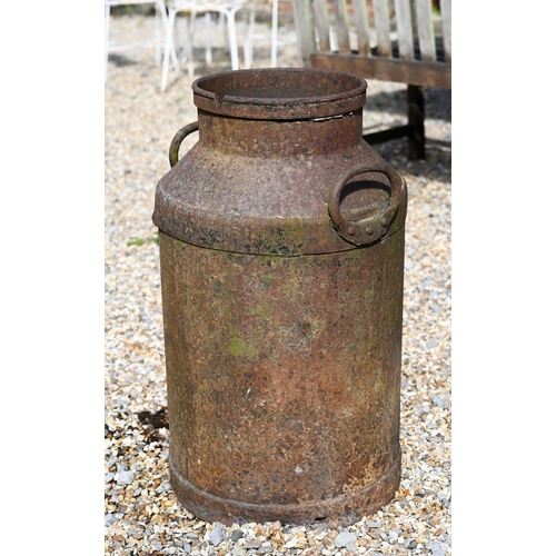 27 - A cast iron milk churn, a/f, 65 cm high