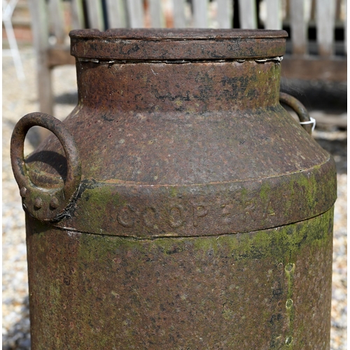 27 - A cast iron milk churn, a/f, 65 cm high