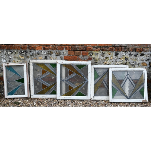 34 - Five various geometric stained and leaded glass panels within painted wooden frames (5)