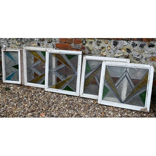 34 - Five various geometric stained and leaded glass panels within painted wooden frames (5)