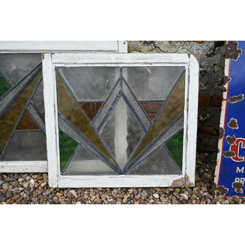 34 - Five various geometric stained and leaded glass panels within painted wooden frames (5)