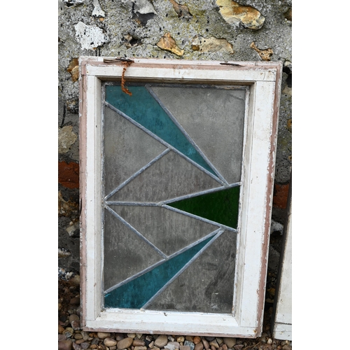 34 - Five various geometric stained and leaded glass panels within painted wooden frames (5)