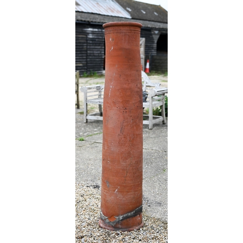 35 - A tall terracotta cylindrical chimney pot, 150 cm high