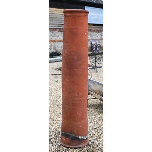 35 - A tall terracotta cylindrical chimney pot, 150 cm high